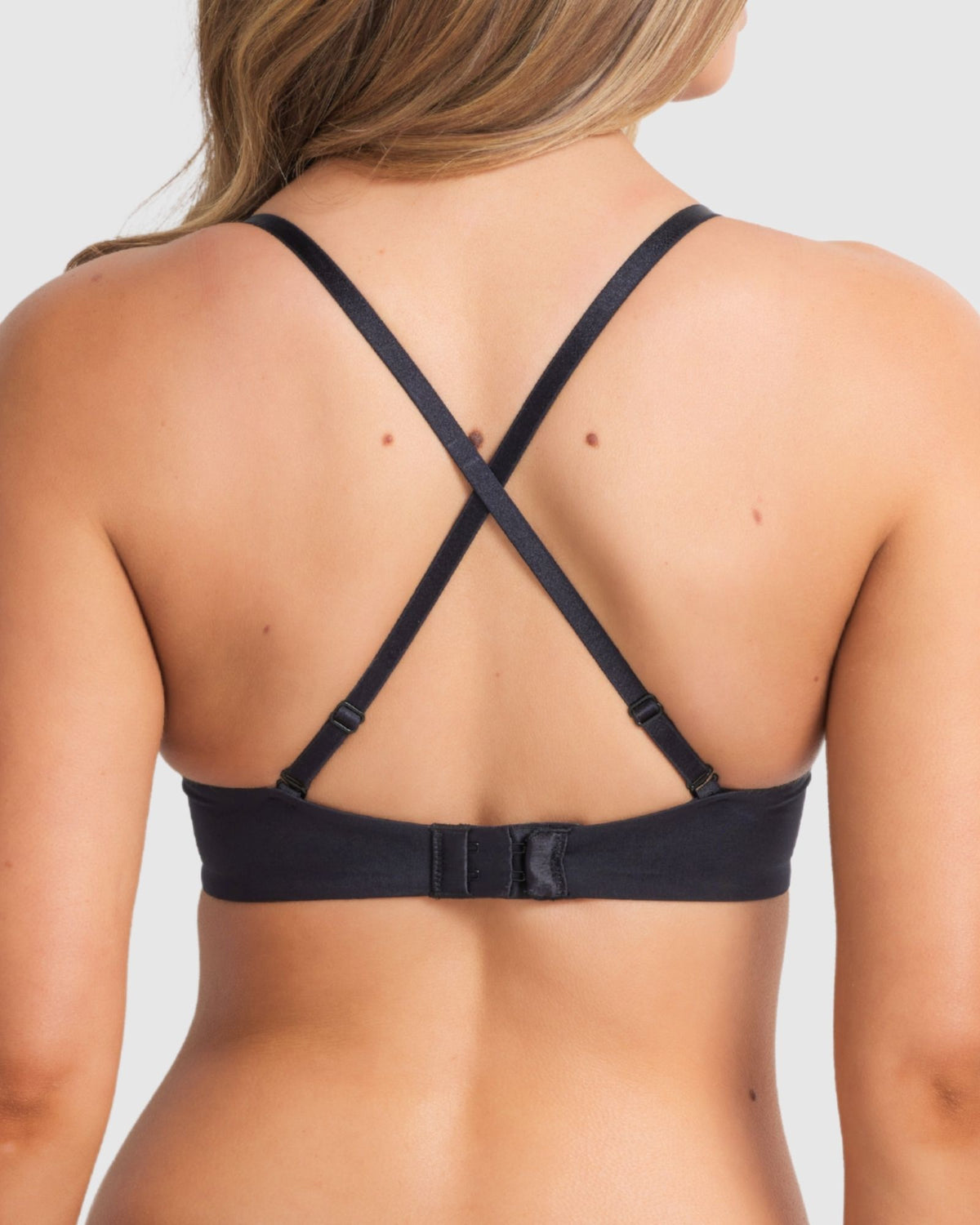 Black push-up bra with convertible criss-cross straps for versatile wear and extra support.