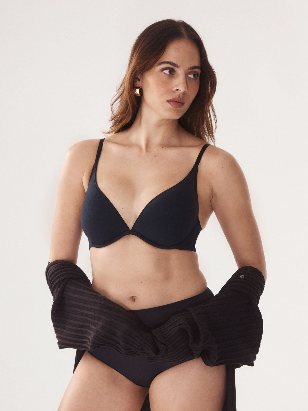 Isabella wears the Cotton Plunge Bra in Black by Fine lines Lingerie