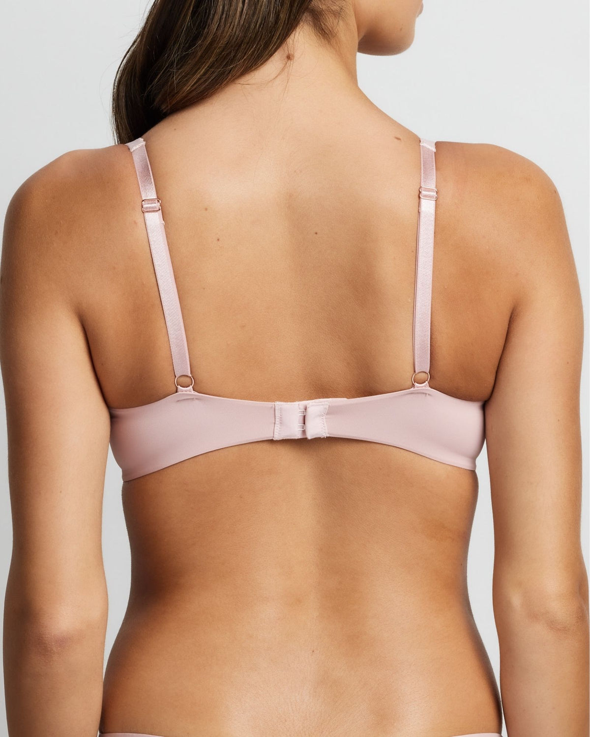 Side angle of pastel pink plunge bra with mesh cups