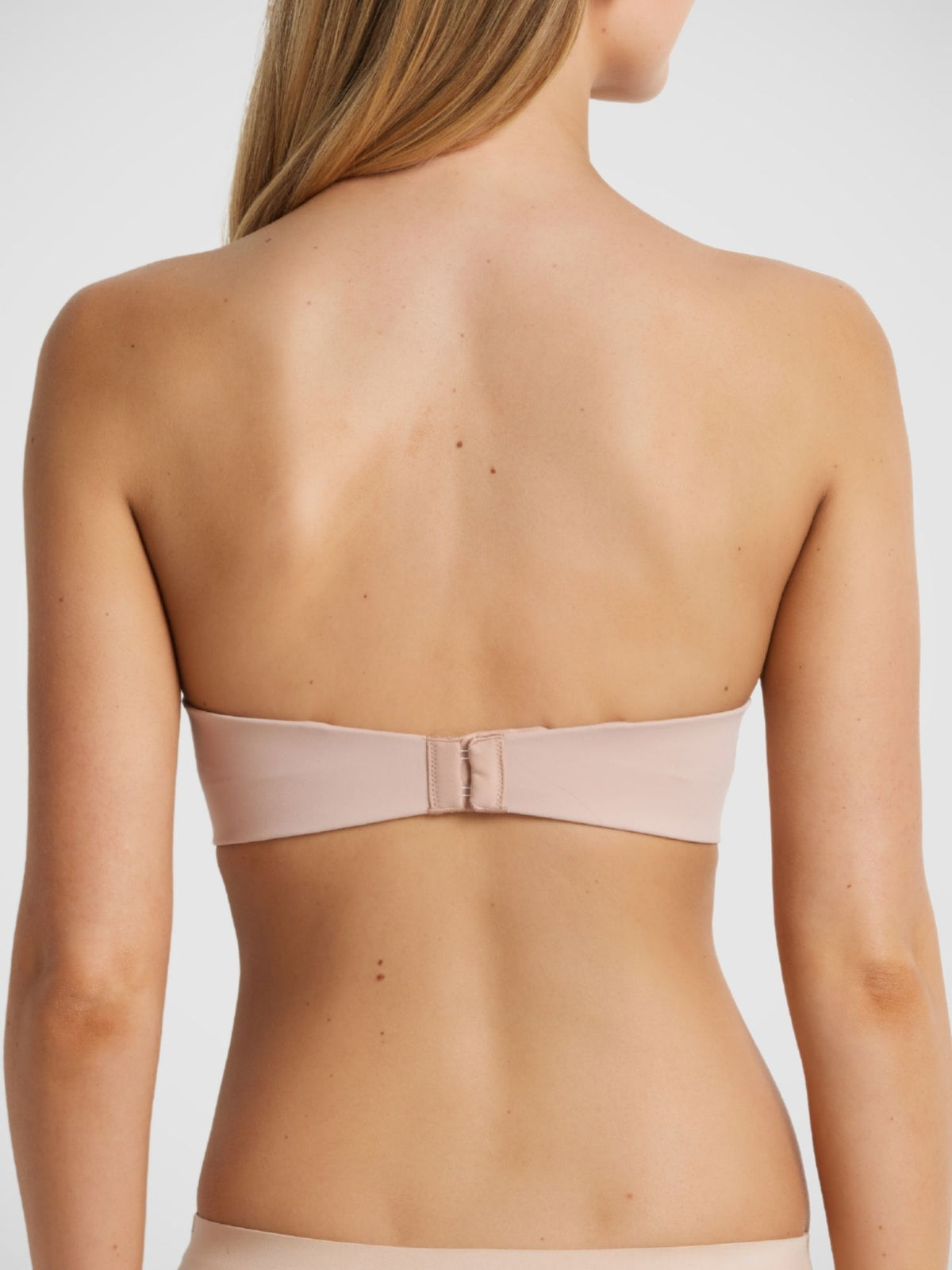 Memory Strapless Bra in Warm Taupe strapless back view, wide wing elastic, gold hardware, four row hook and eye closure