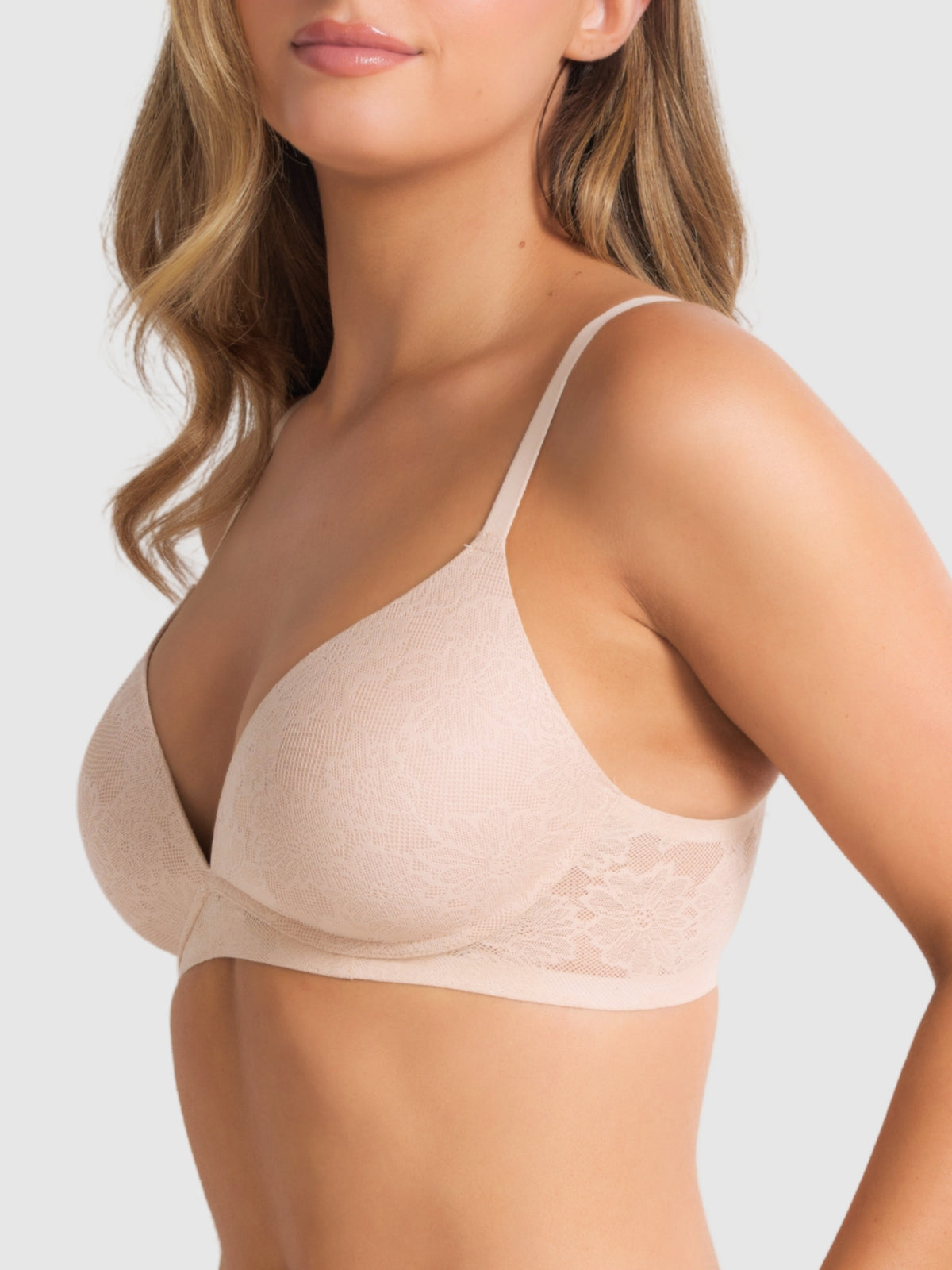 Side angle of model in the wire-free bra, showing natural shape, lace wings and lightweight fit.