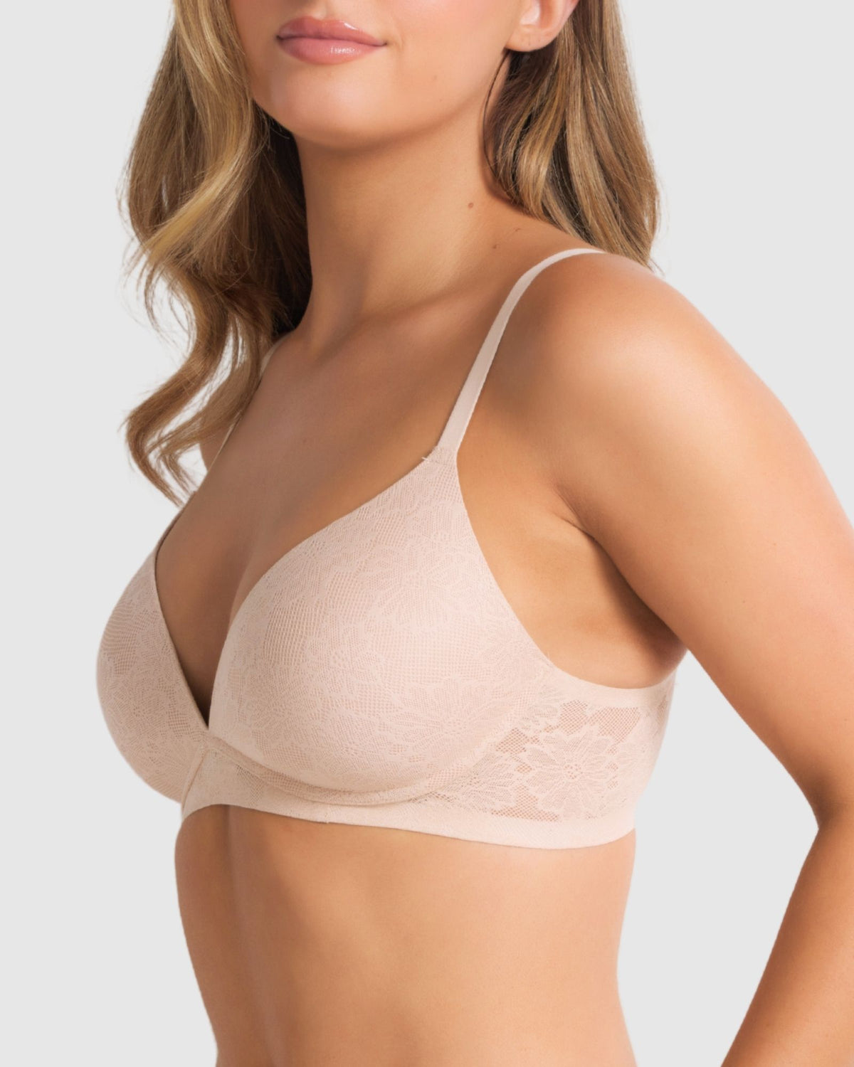 Side angle of model in the wire-free bra, showing natural shape, lace wings and lightweight fit.
