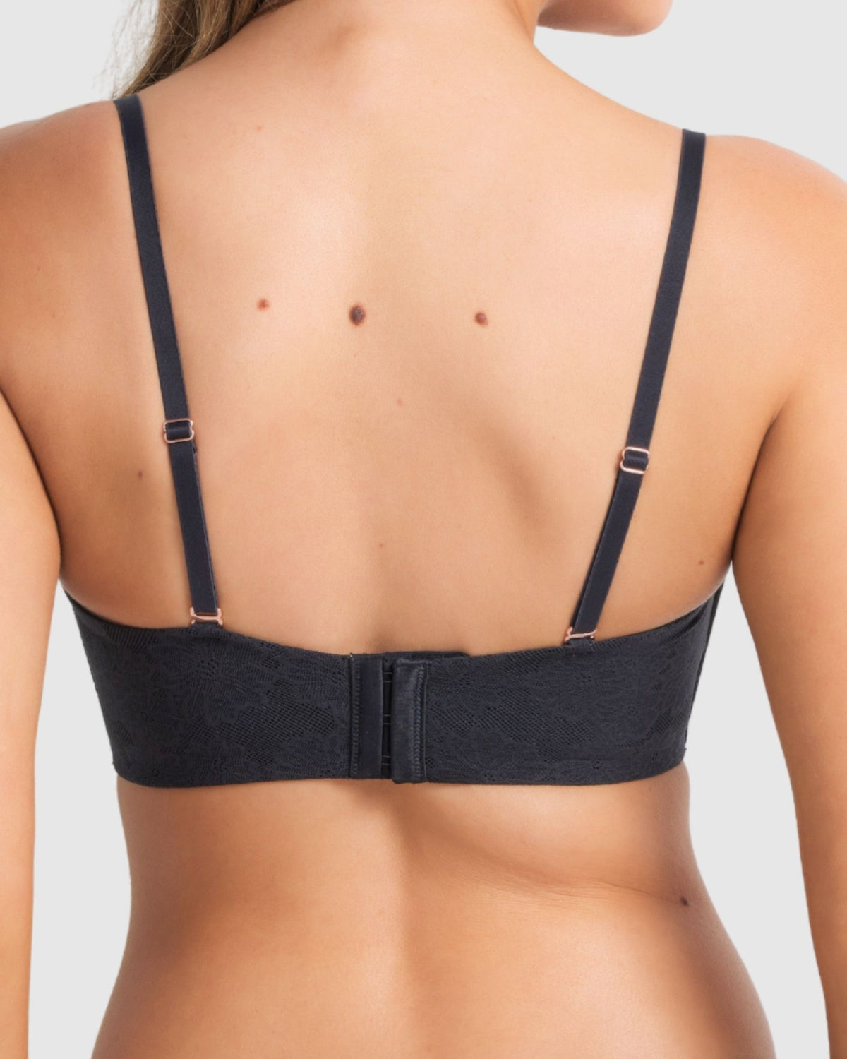 Black strapless bra styled with removable straps detached, ready for multiple conversions.