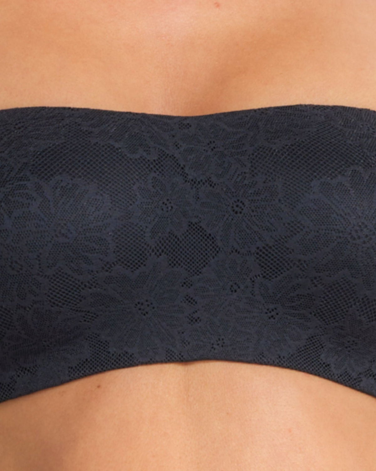 Close-up of the black lace fabric with intricate floral detailing and fused smooth edges.