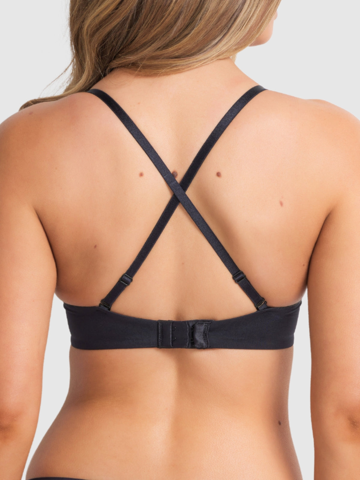 Black push-up bra with convertible criss-cross straps for versatile wear and extra support.