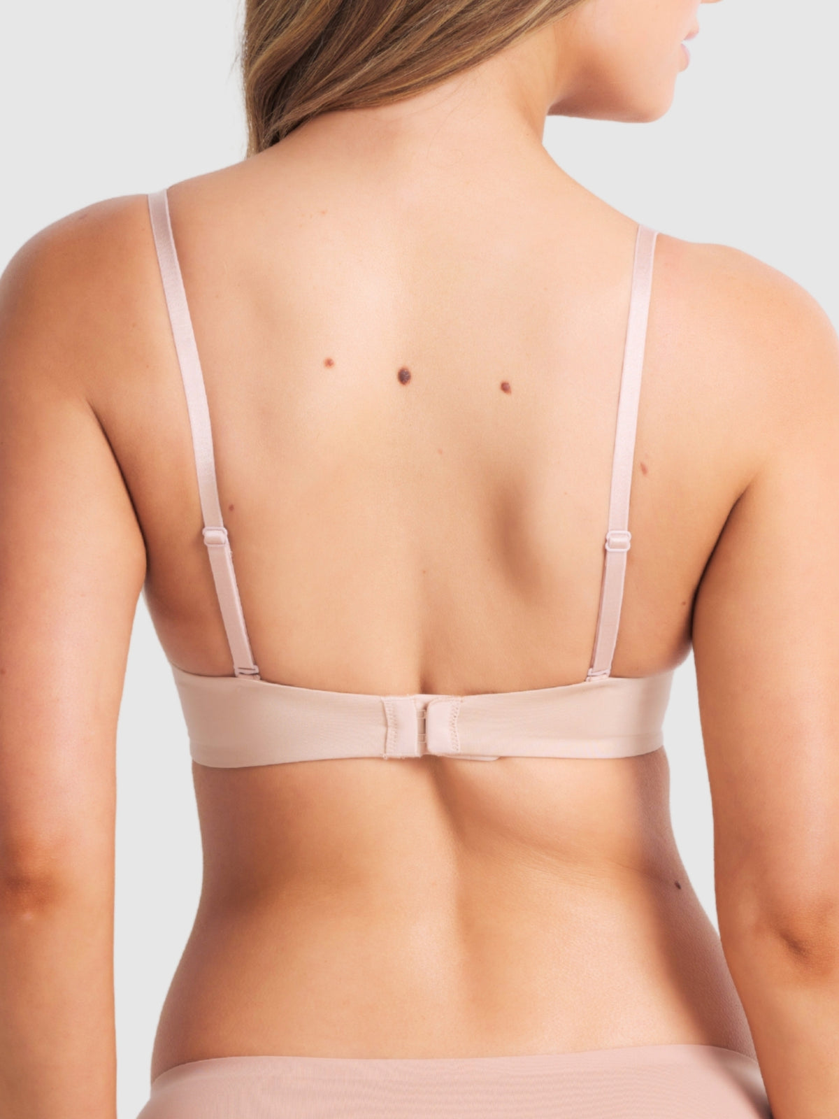 Back of beige bra showing regular straps and smooth wings.