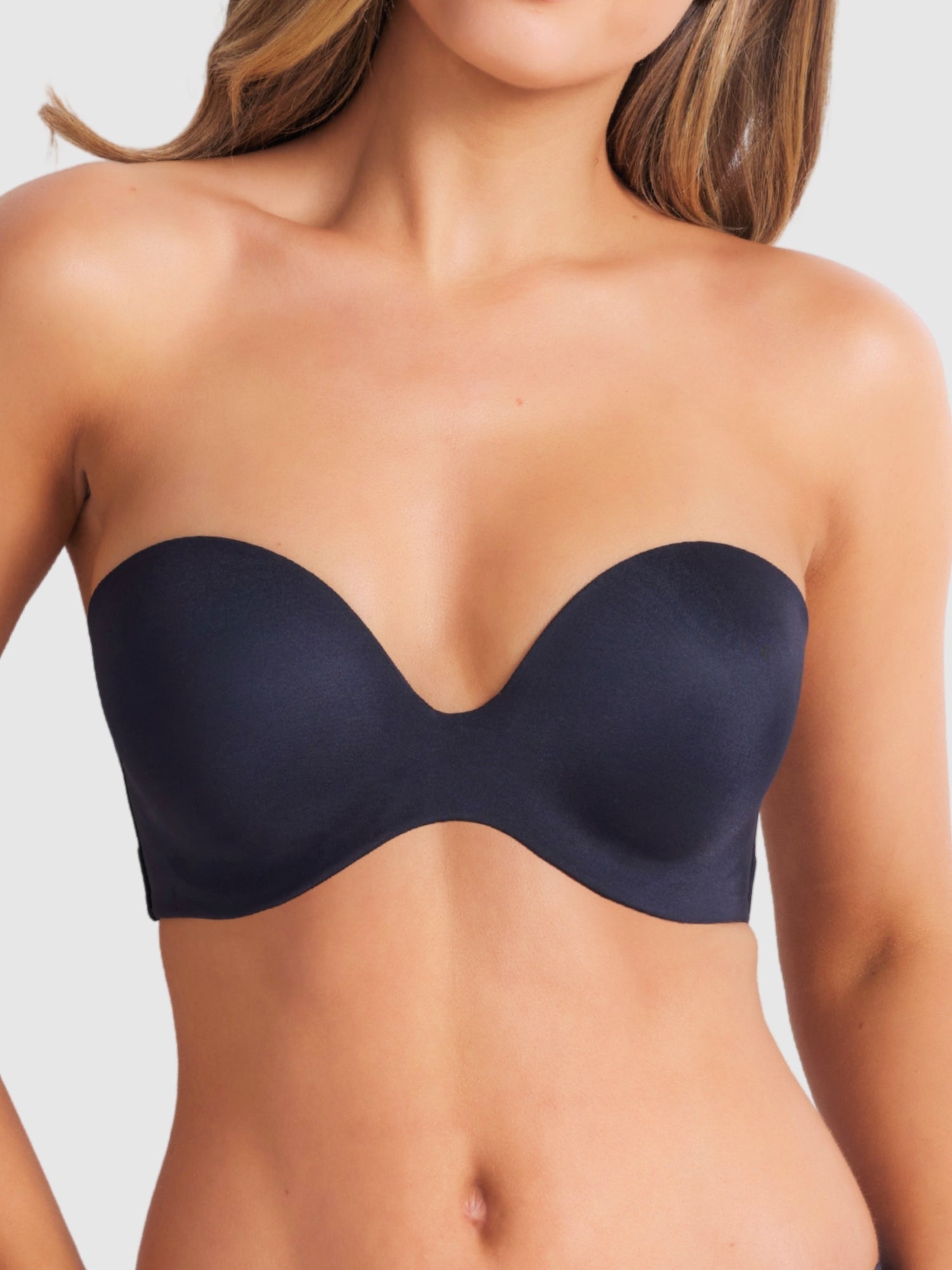 Front view of black strapless plunge bra with smooth finish and supportive structure.