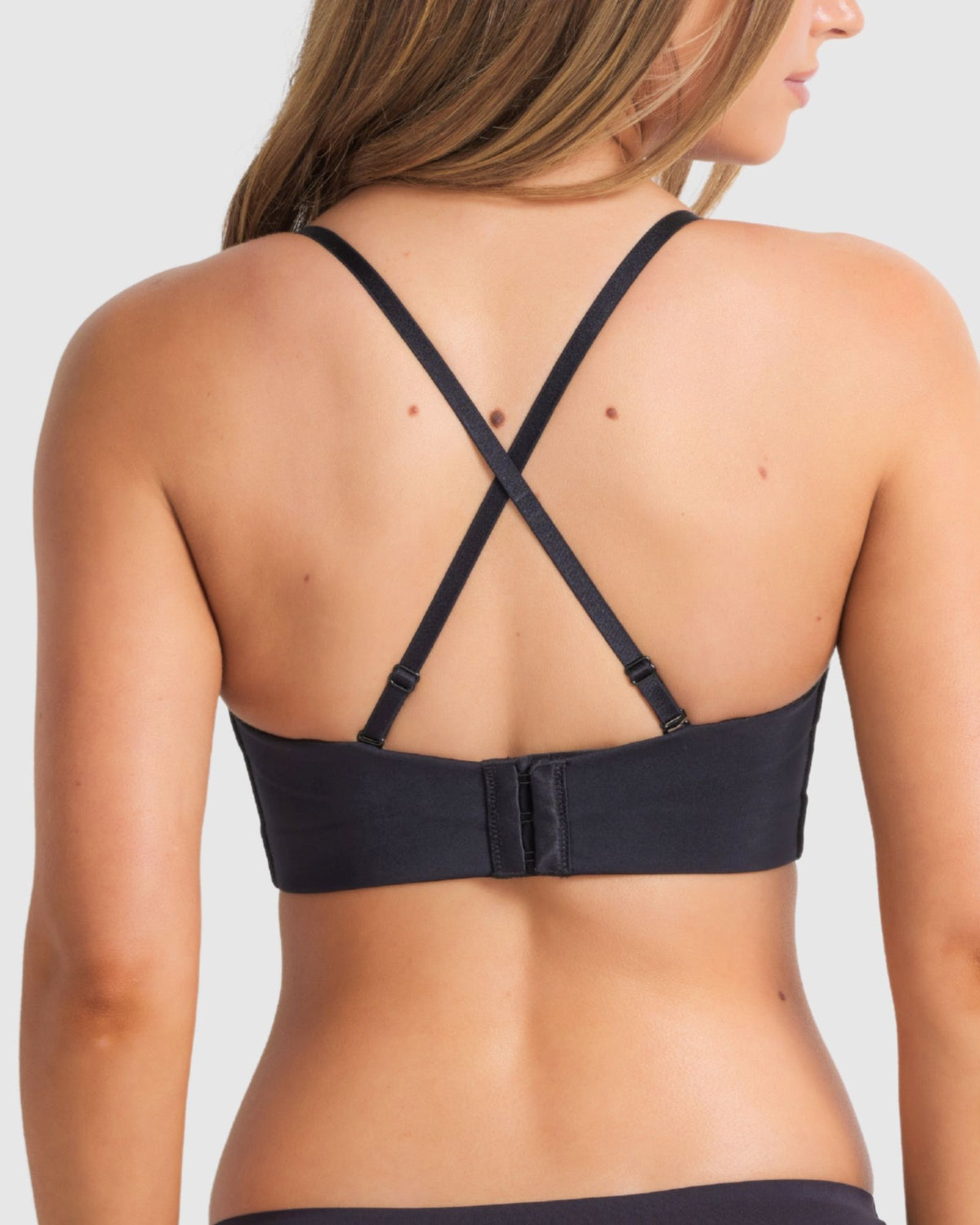 Crossback styling of Attitude plunge bra in black for extra lift and secure fit for racerback tops.