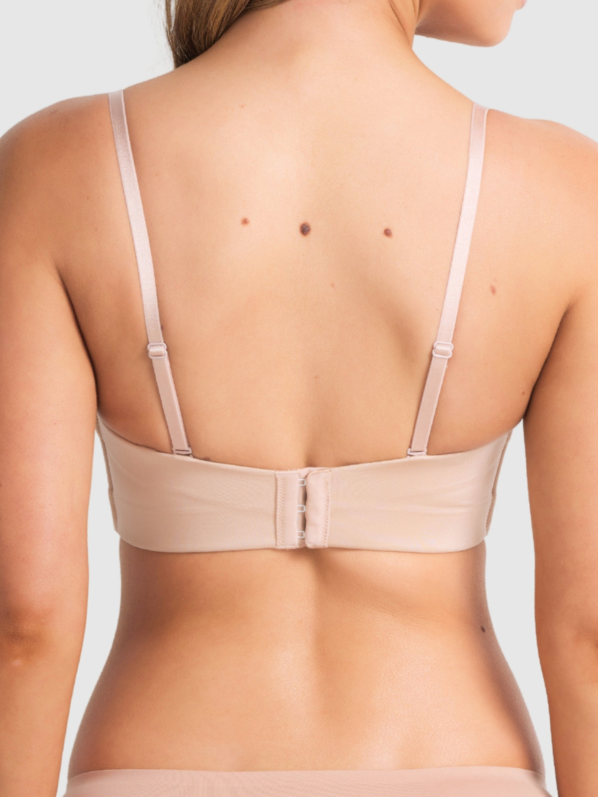 Back view of full figure bra with straight adjustable straps and soft wings.