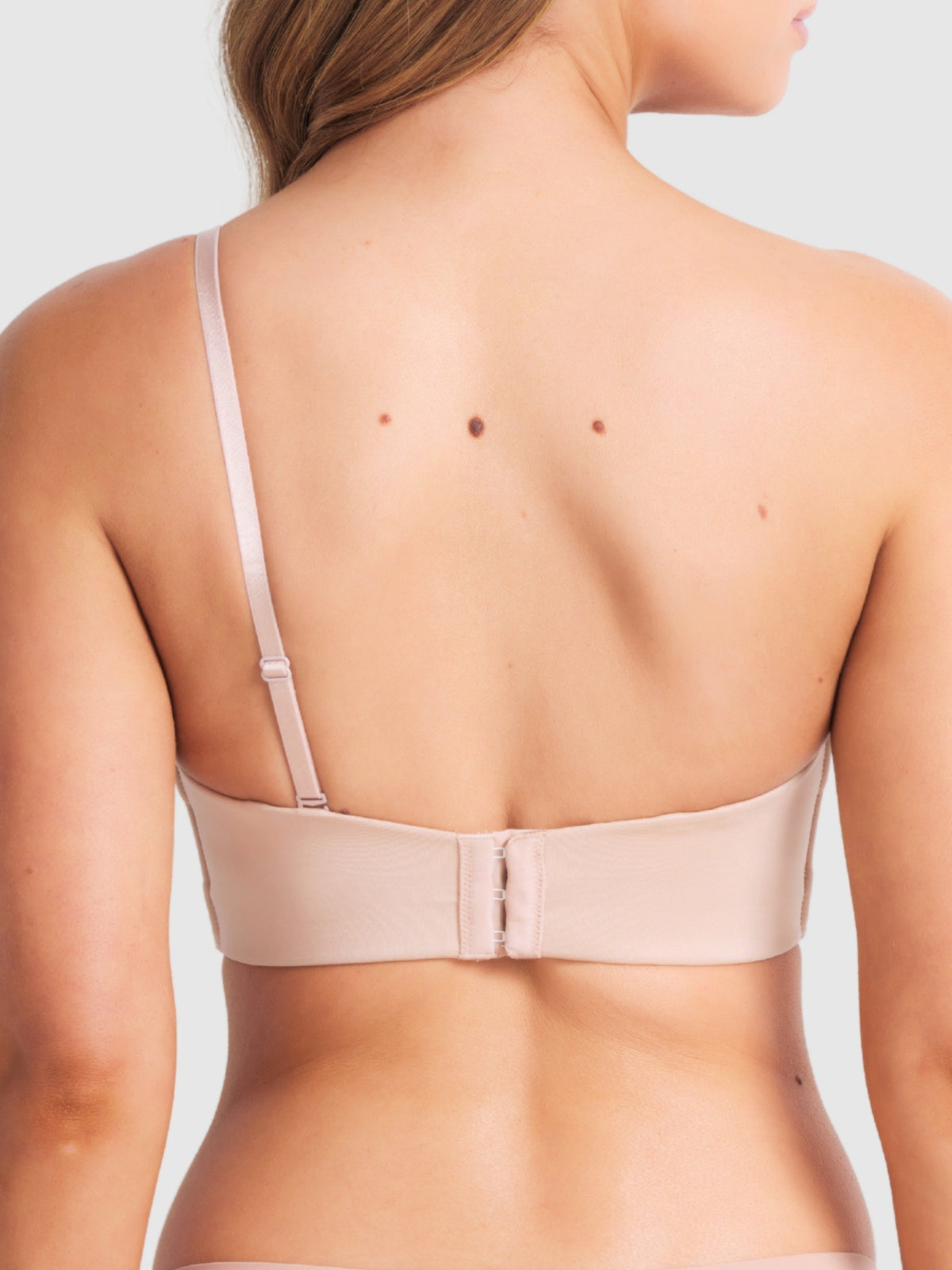 Back of plunge bra in one-shoulder configuration showing adjustable strap.