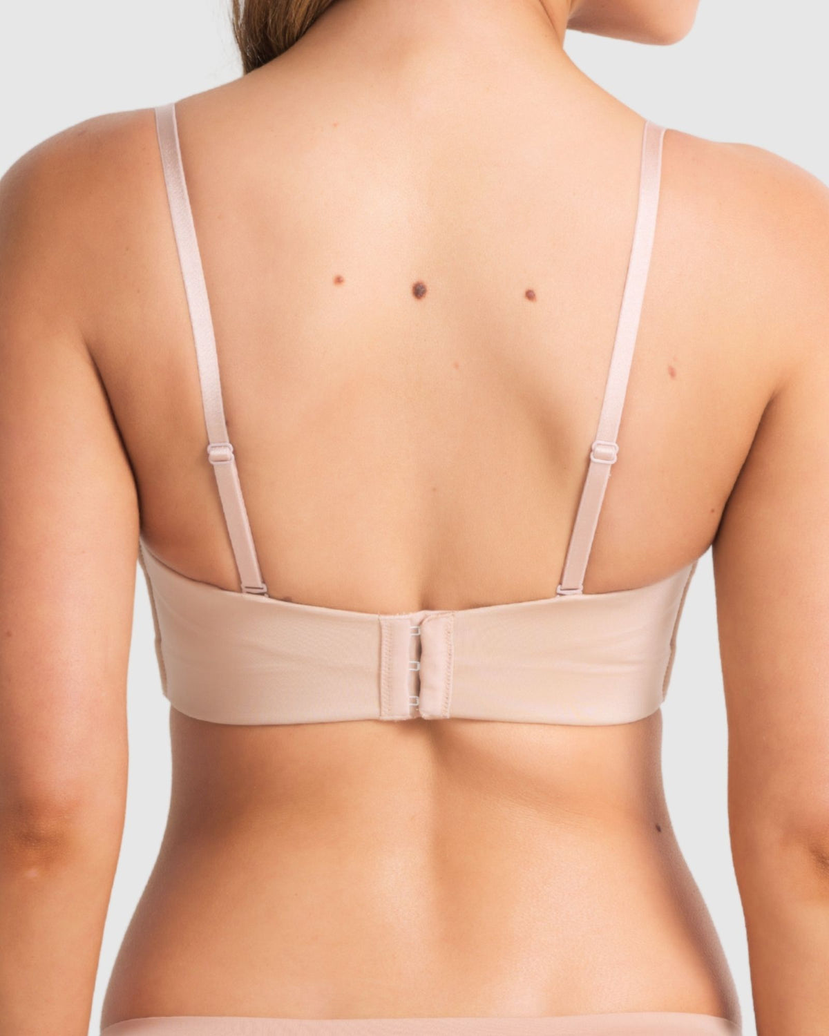 Back of full coverage black bra showing regular straps conversion.
