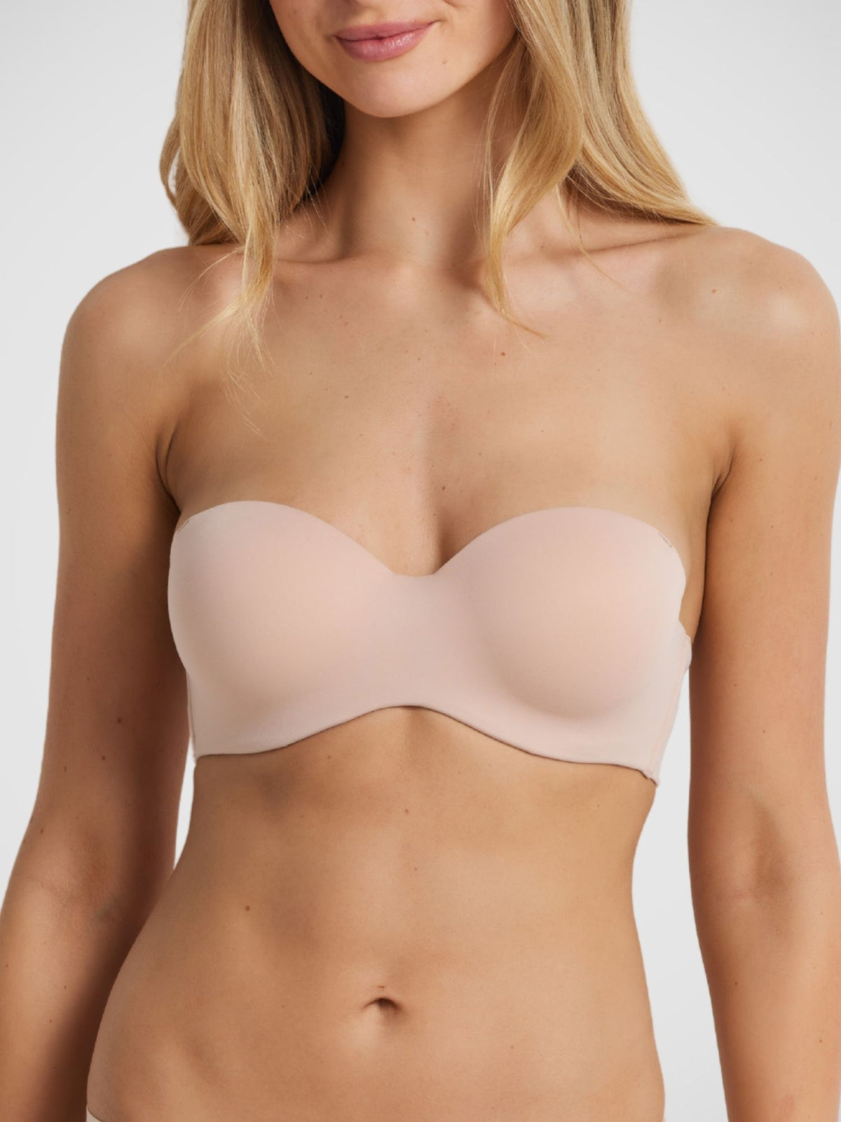 Memory Strapless Bra in Warm Taupe, non-crease memory foam strapless bra wide wing elastic, model Milla front view