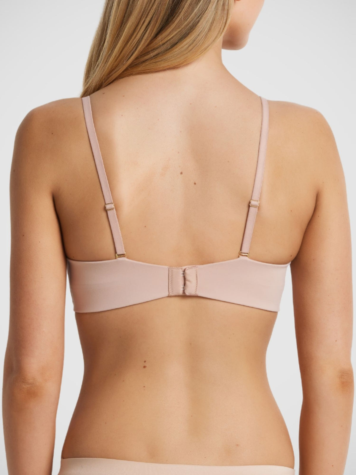Memory Strapless Bra in Warm Taupe back view, regular strap configuration, gold hardware, four row hook and eye closure