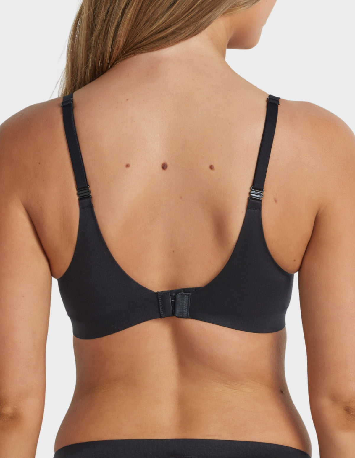 Back view of the Ultrasoft Full Coverage T-Shirt Bra in Black with adjustable straps and secure hook-and-eye closure