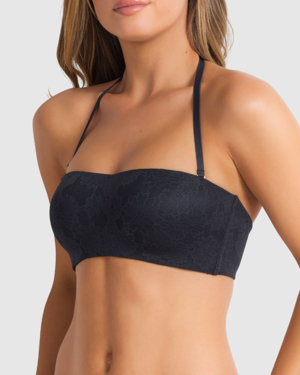 Side profile of the bra work halter neck style on a model, highlighting the moulded, wire-free cups.
