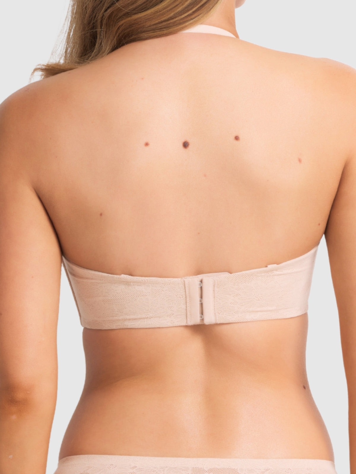 Back view of the bra converted to halter neck style, demonstrating strap adjustability and support.