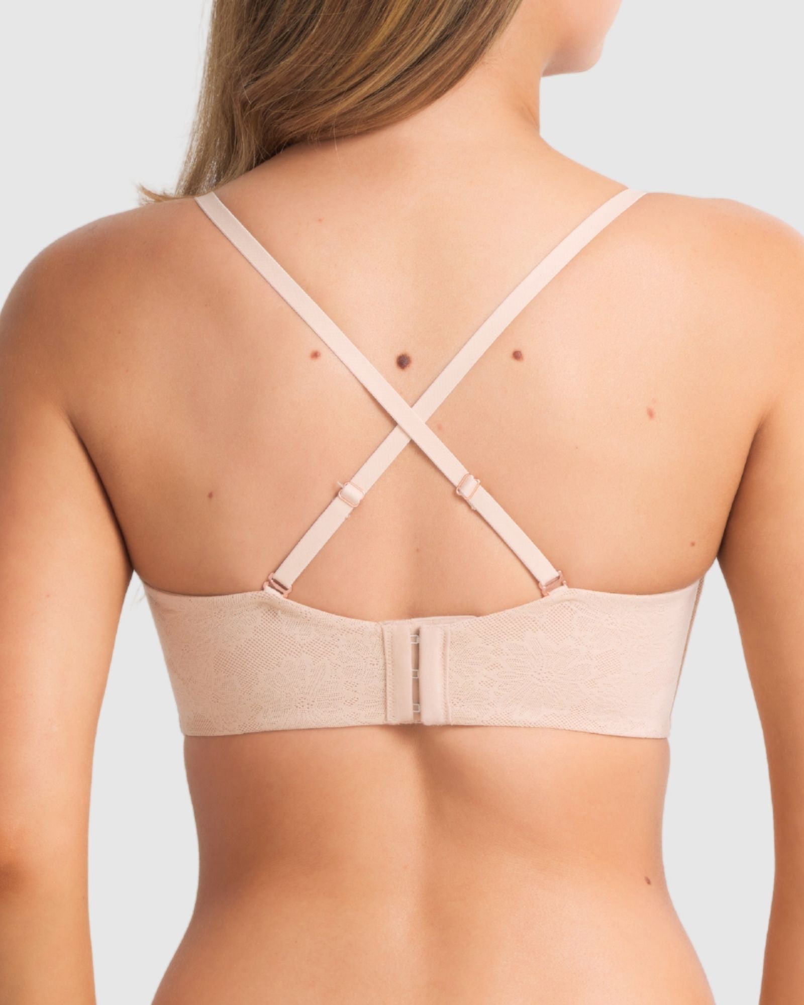 Model wearing the bra in strapless mode, focusing on secure fit and side boning support.