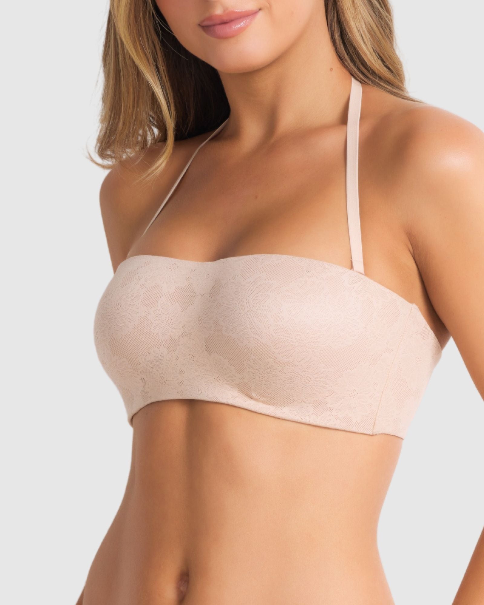 Model wearing the bra in strapless mode, focusing on secure fit and side boning support.