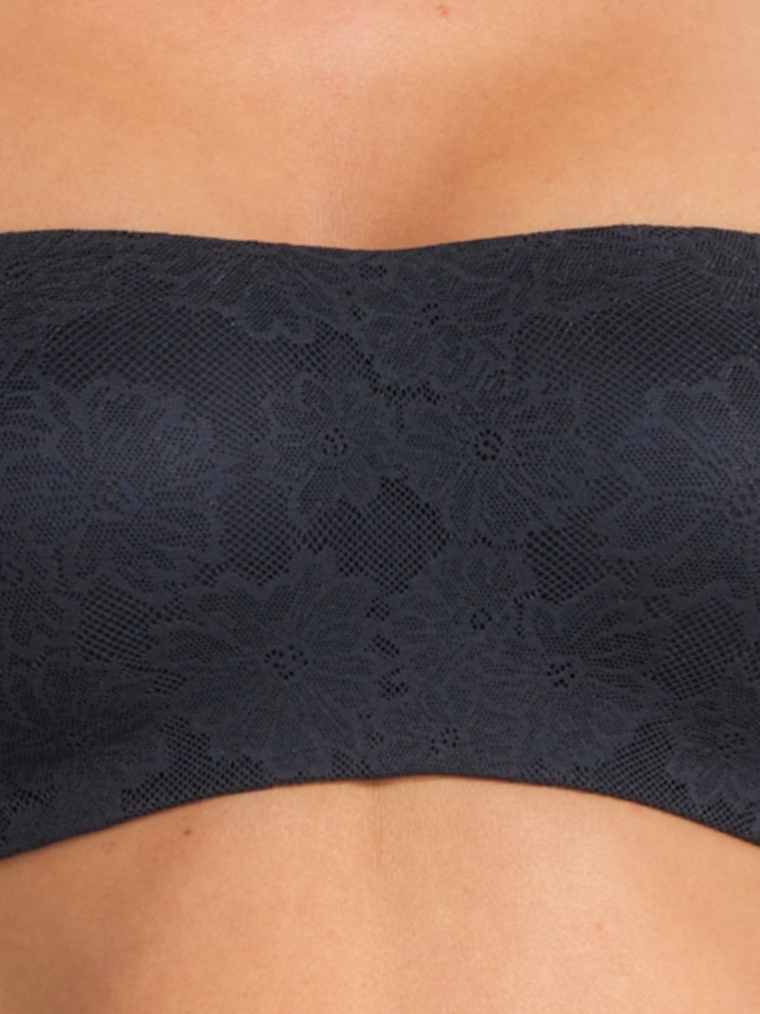 Model wearing the black strapless bra, emphasising secure support.