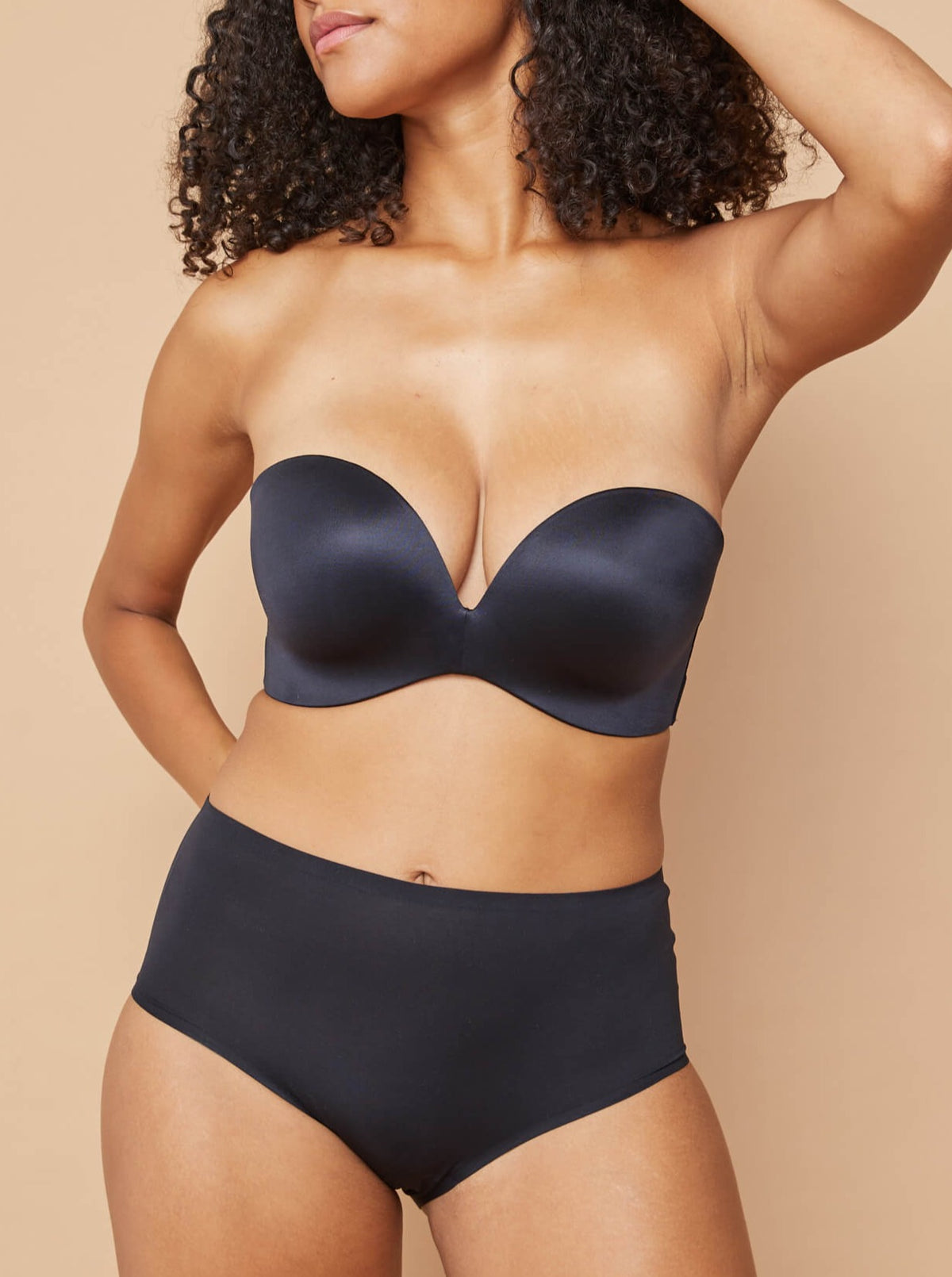 Front of woman wearing Fine Lines Invisibles Full Brief in Black and strapless bra
